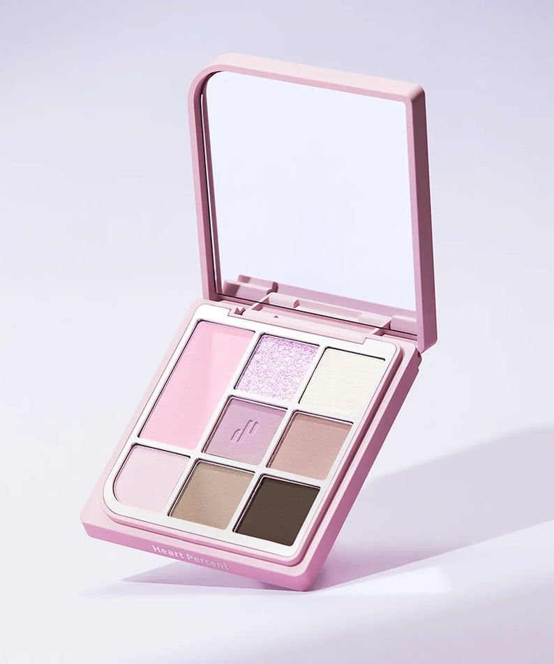 Palette de maquillage ouverte montrant diverses nuances neutres, HEART PERCENT Dot On Mood Eye Palette, coffret rose élégant.