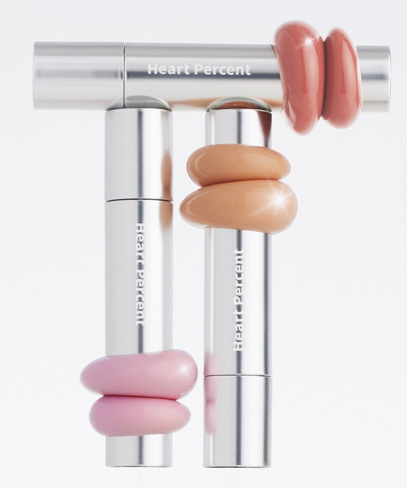 HEART PERCENT Dot On Mood One Way Glow Tint - rouge à lèvres éclatant en nuances rose, pêche et beige, design chic et moderne.