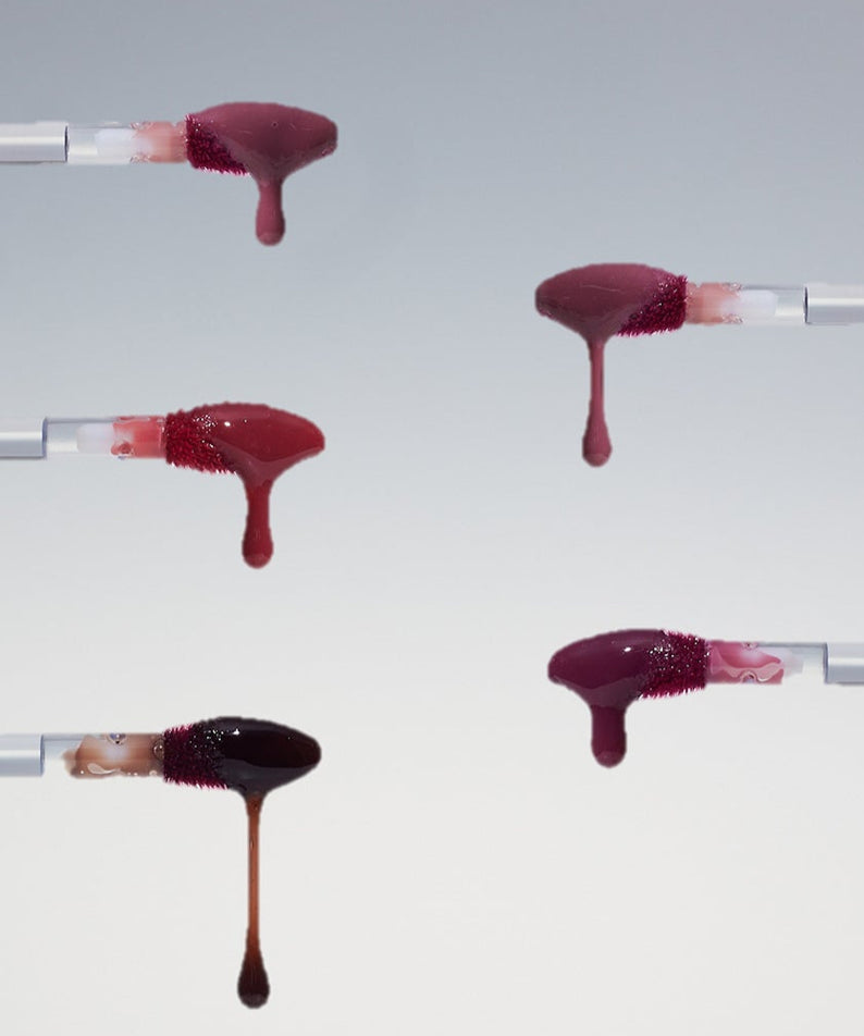 Collection de teintes du produit HEART PERCENT Dot On Mood One Way Glow Tint, avec des applicateurs montrant les différentes couleurs.