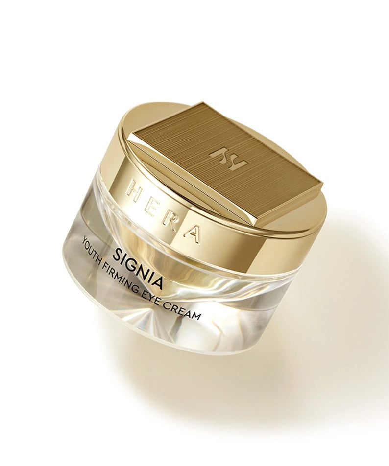 HERA Signa Youth Firming Eye Cream 30ml de HERA, flacon doré sur fond blanc, gros plan produit maquillage