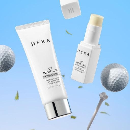 HERA UV Protector Extreme-Force Leports SPF50+PA++++ HERA sur fond bleu avec balles de golf et feuilles, mise en scène produit.
