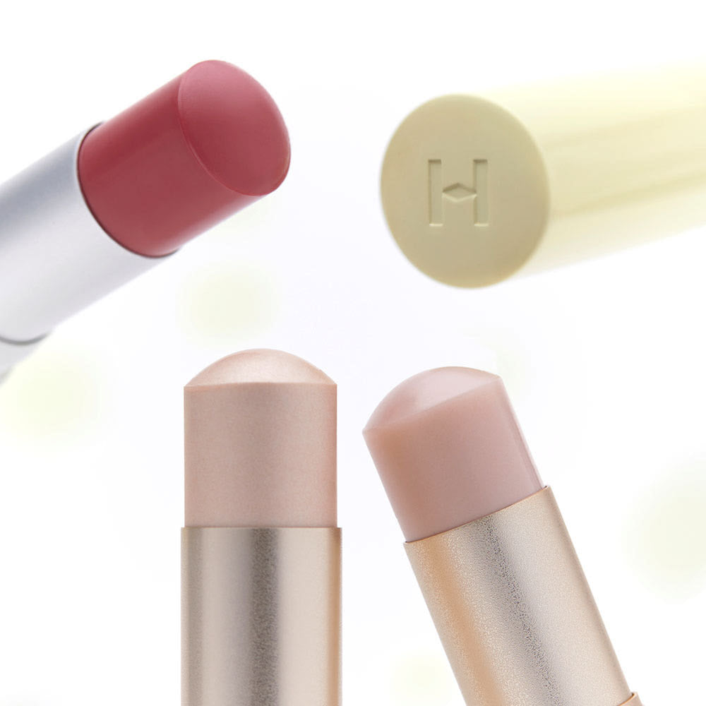 HINCE True Dimension Radiance Balm 10g, baume lissant; marque HINCE, visuel sur tube et stick nude sur fond clair.