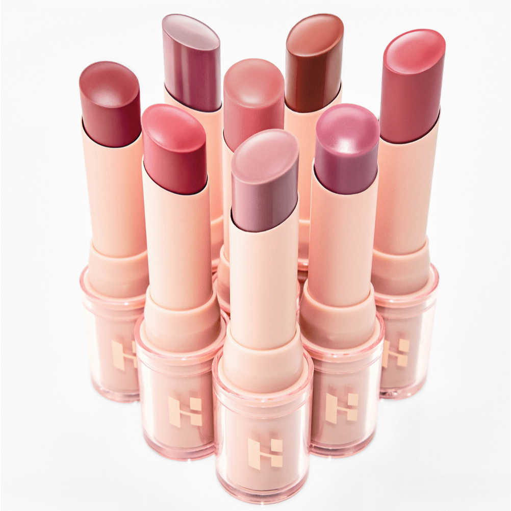 HOLIKA HOLIKA Glow Rise Balm : rouges à lèvres baume en tubes roses, marque sur fond blanc, visuel produit beauté.