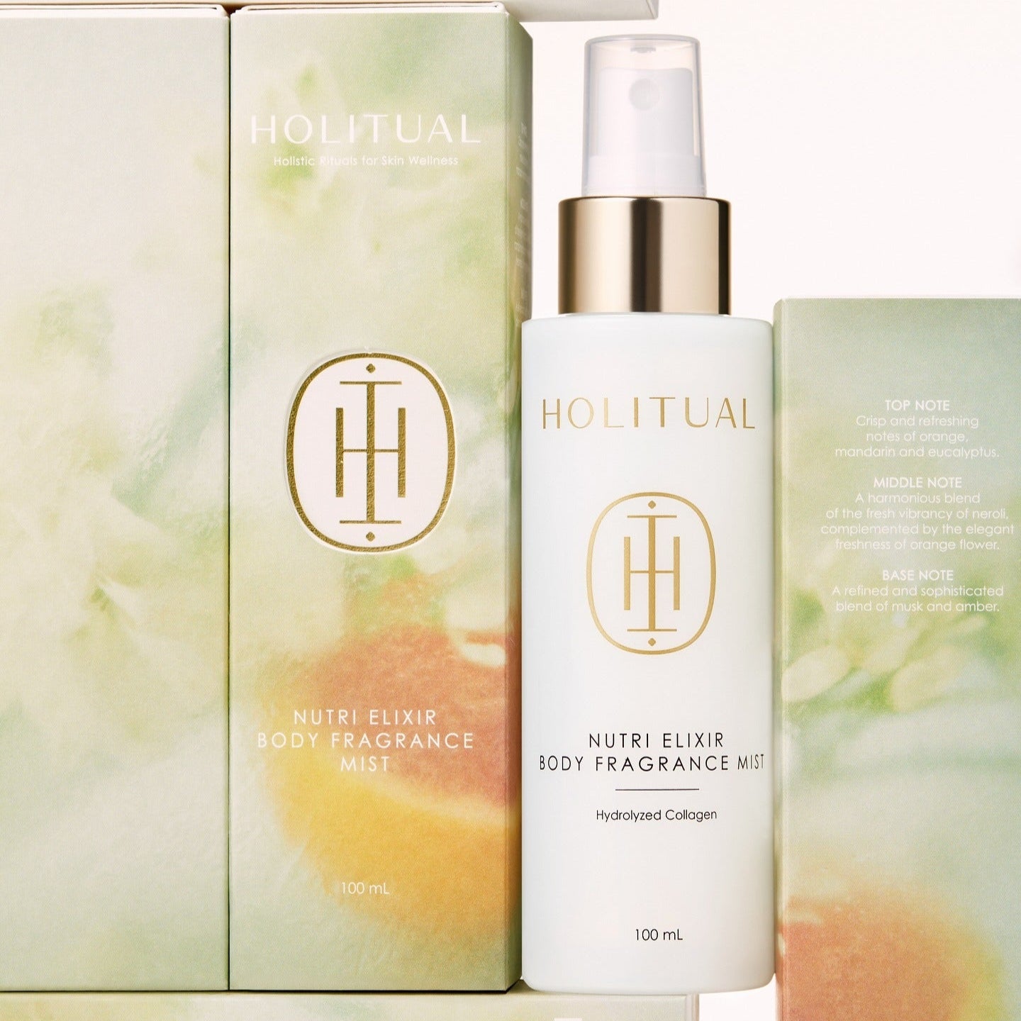HOLITUAL Nutri Elixir Body Fragrance Mist 100ml, brume parfumée flacon et boîte, sur fond crème avec visuel floral