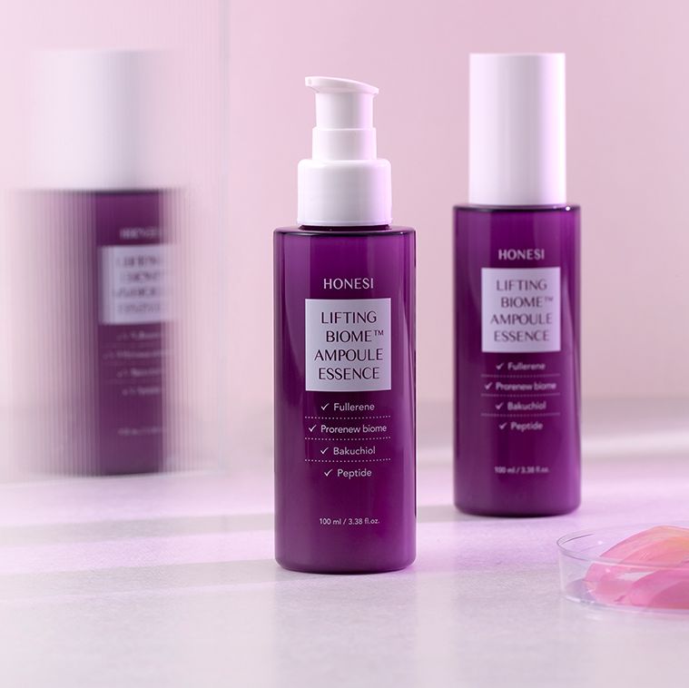 HONESI Ernish Lifting Biome Elasticity Ampoule Essence 100ml, flacons violets sur fond clair, marque HONESI en contexte beauté.