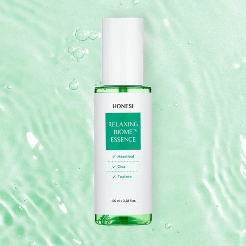HONESI  Relaxing Biome Ampoule Essence 100ml, flacon vert sur fond aquatique apaisant, gouttes et bulles.