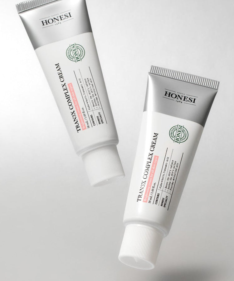 HONESI  Tranex Complex Cream 50ml, tube de crème cosmétique de la marque HONESI sur fond blanc.