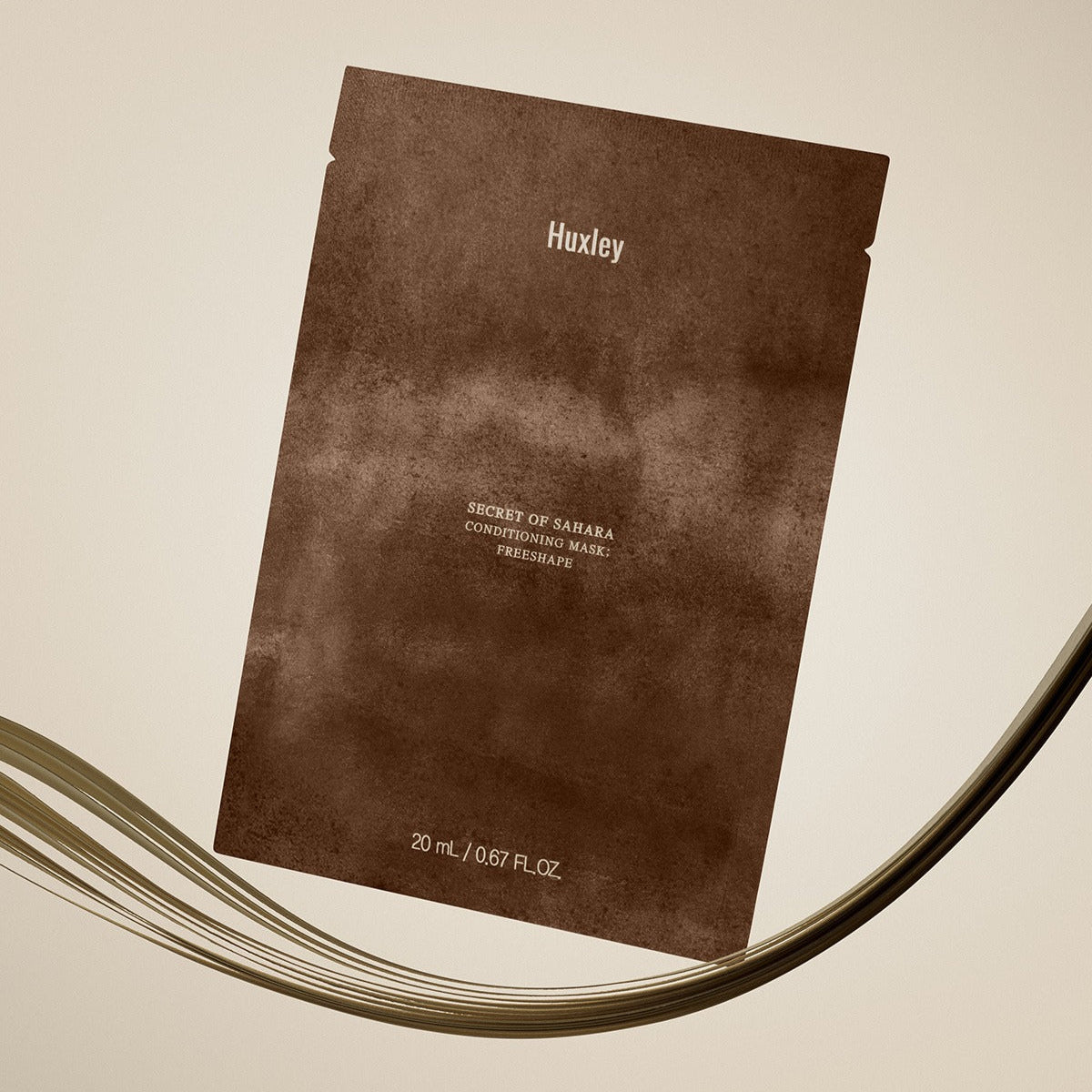 HUXLEY Conditioning Mask Freshape 20ml de Huxley : sachet brun sur fond clair, rendu visuel produit beauté.