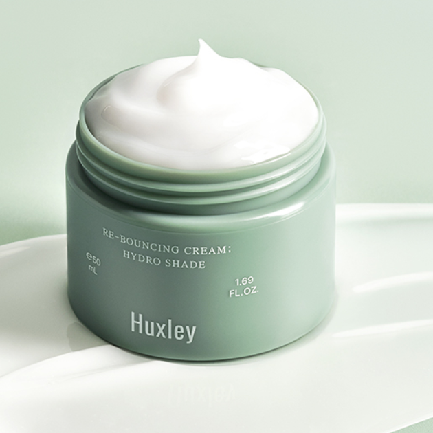 HUXLEY Rebouncing Cream Hydro Shade 50ml : crème hydratante verte en pot, texture blanche sur fond clair, marque Huxley