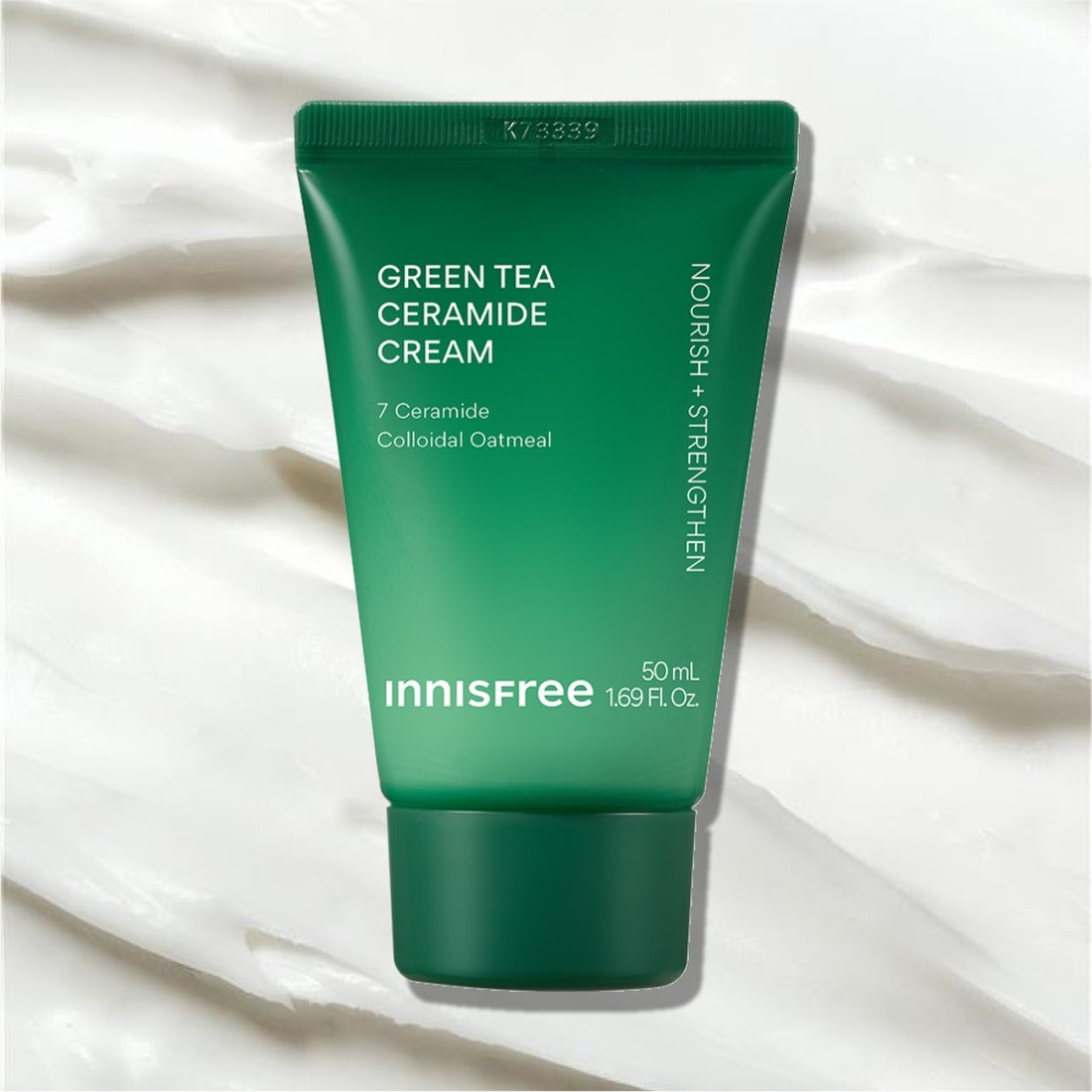 INNISFREE Green Tea Ceramide Cream 50ml (Tube), tube vert sur fond blanc froissé, produit Innisfree en gros plan.