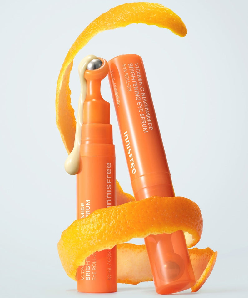 INNISFREE Vitamin C Niacinamide Brightening Eye Serum 10ml, marque Innisfree, tube orange sur fond blanc, goutte d’agrume.