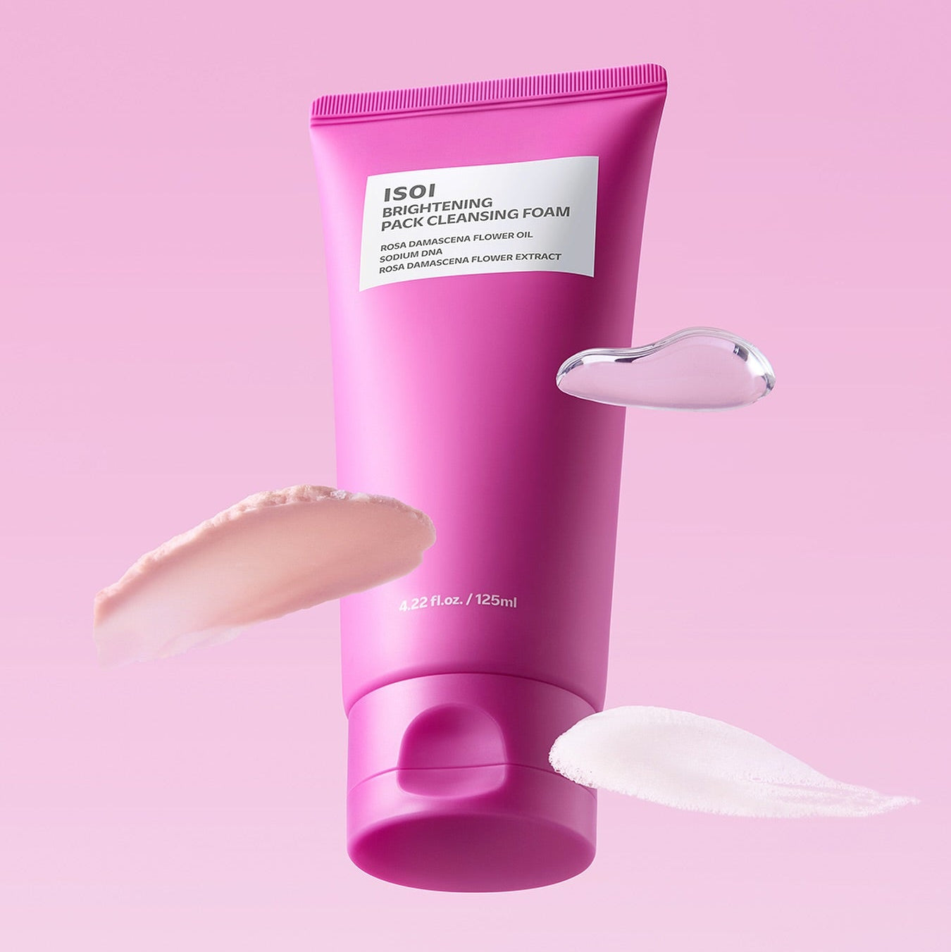 IS OI Brightening Pack Cleansing Foam 125ml de la marque IS OI, flacon rose sur fond rose, mousse au savon
