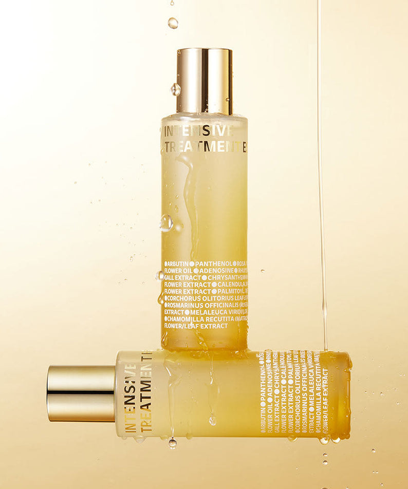 ISOI Intensive Treatment Essence 130ml, flacon doré avec gouttes sur fond beige, produit de la marque ISOI