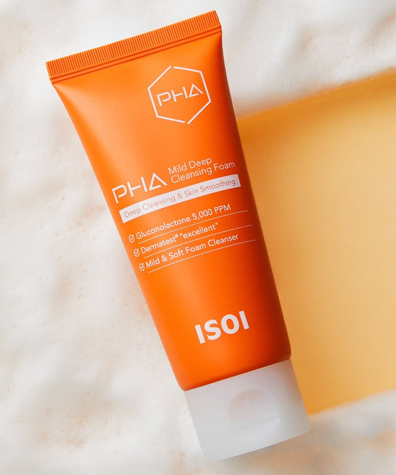 Décris l'image en français : ISOI PHA Mild Deep Cleansing Foam 100ml, tube orange sur fond clair, crème visage nettoyante.