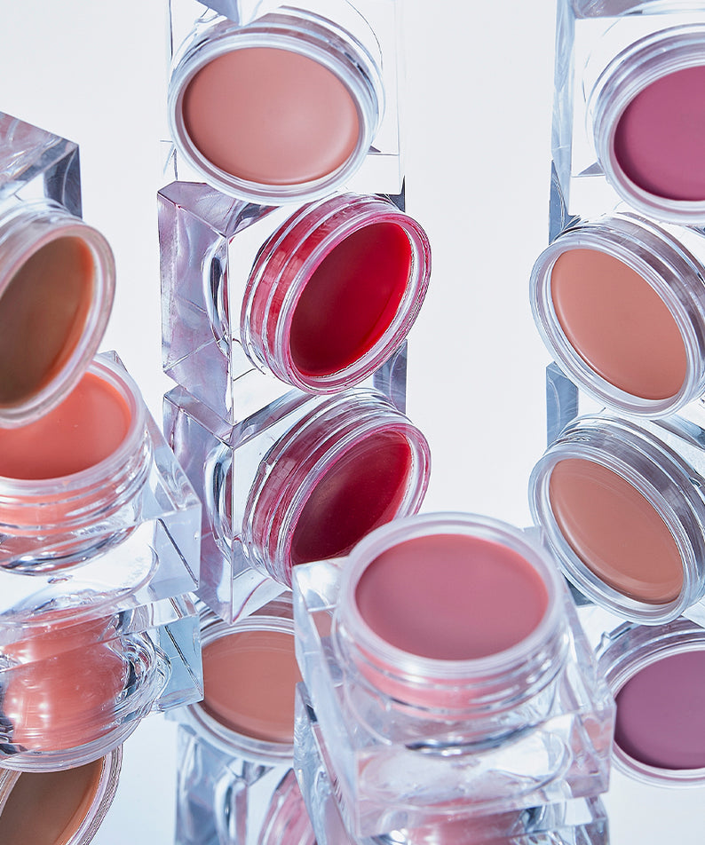 Blush crème IVI MAD PEACH Mood Mix, présentation de différentes teintes dans des pots transparents élégants.