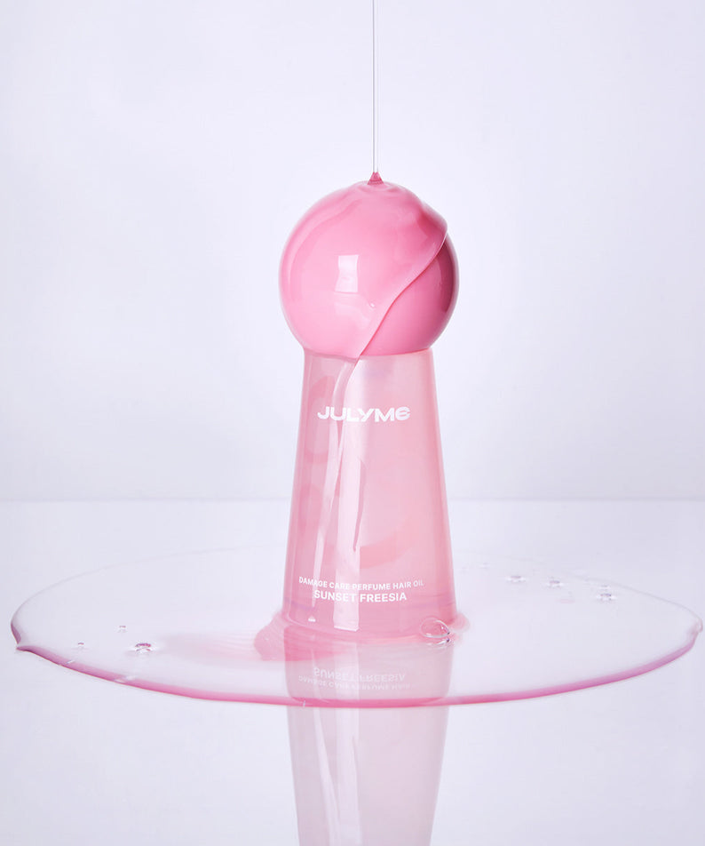 Flacon de JULYME Damage Care Perfume Hair Oil 30ml (Sunset Freesia) sur fond blanc, design élégant et moderne.