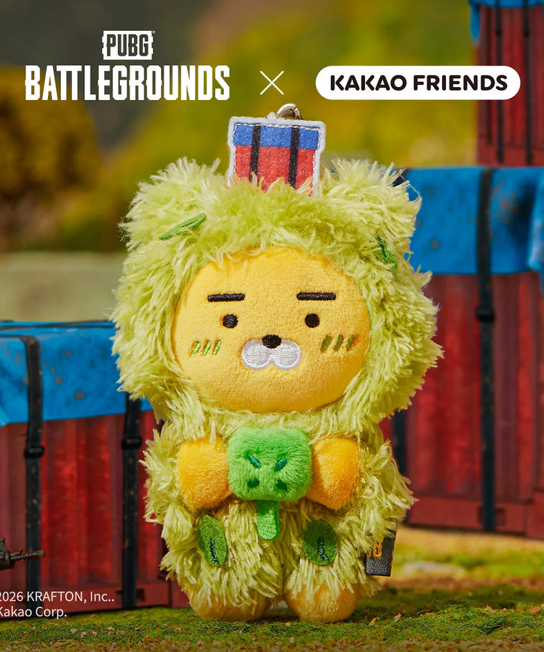 KAKAO FRIENDS Battleground X Friends Keychain Doll, porte-clés peluche jaune face au décor PUBG Battlegrounds