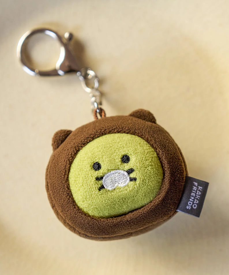 KAKAO FRIENDS Dujjonchun keychain doll en peluche marron, sur fond clair, porte-clés avec anneau argenté.