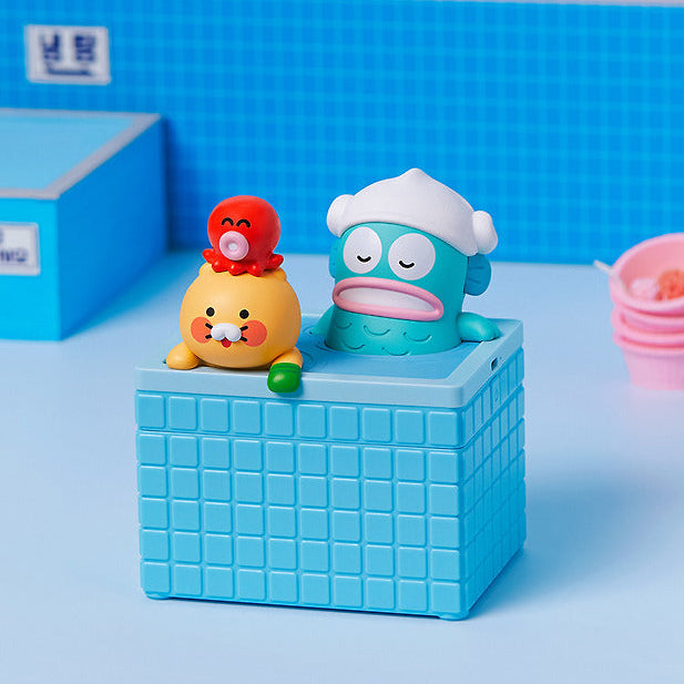 KAKAO FRIENDS  Hangyo-dong X Friends Humidifier Chunshik, humidificateur bleu avec personnages sur table, arrière-plan bleu.