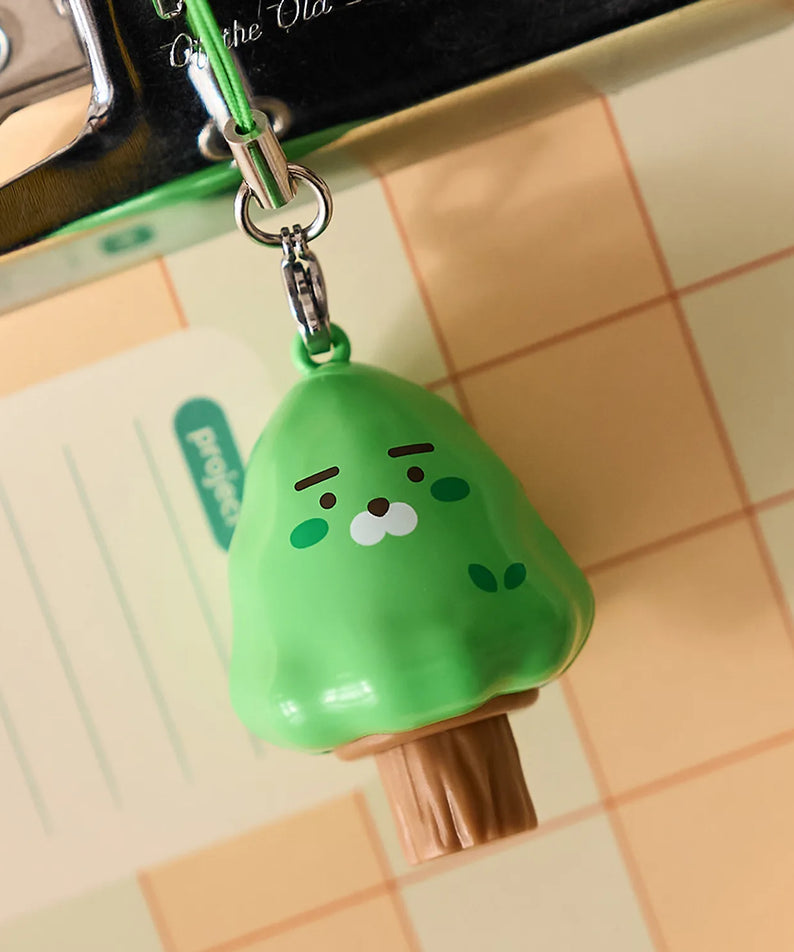 KAKAO FRIENDS Peekaboo Moving Keyring : porte-clés à l’effigie de KAKAO FRIENDS vert, sur carrelage, mouvement visible, marque.