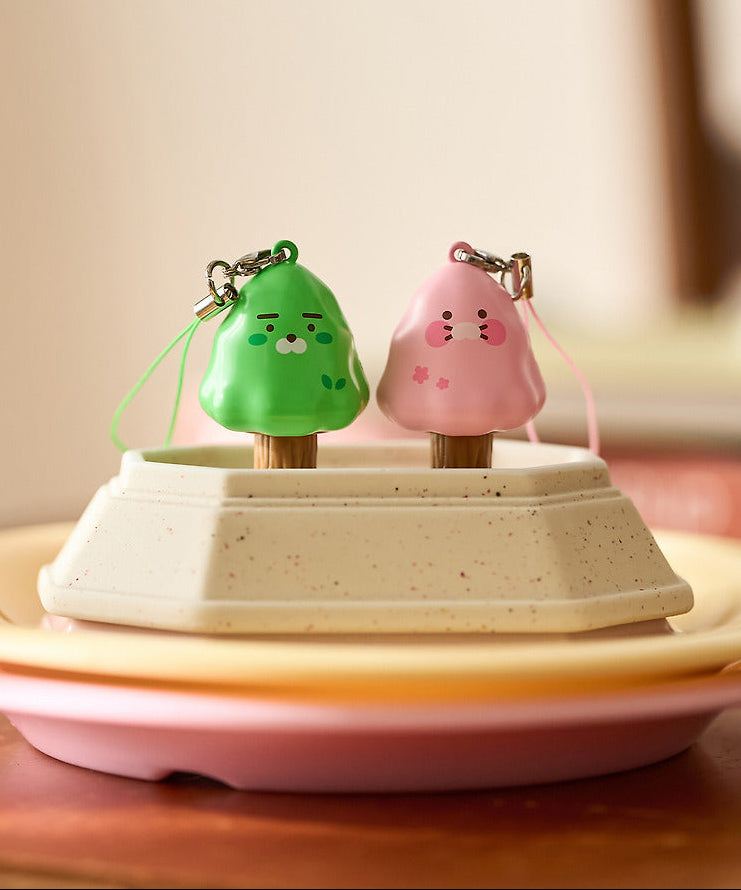 KAKAO FRIENDS Peekaboo Moving Keyring de marque Kakao Friends, figurines mobiles vert et rose sur plateau, intérieur doux.