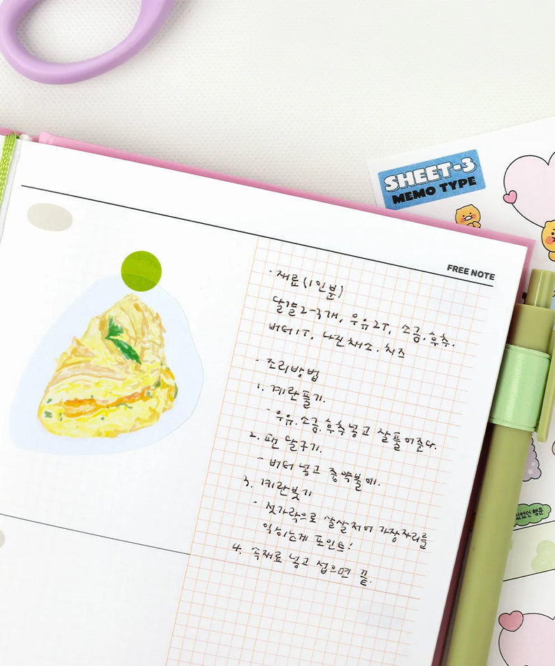 KAKAO FRIENDS Planner 2026 de marque Kakao Friends, pages colorées et animaux, vue rapprochée sur l’agenda.