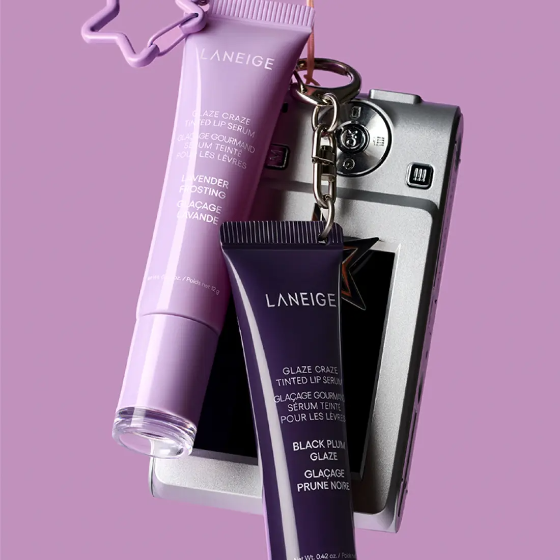 LANEIGE Glaze Craze Tinted Lip Serum en flacon violet, présenté sur fond rose, marque LANEIGE, contexte maquillage