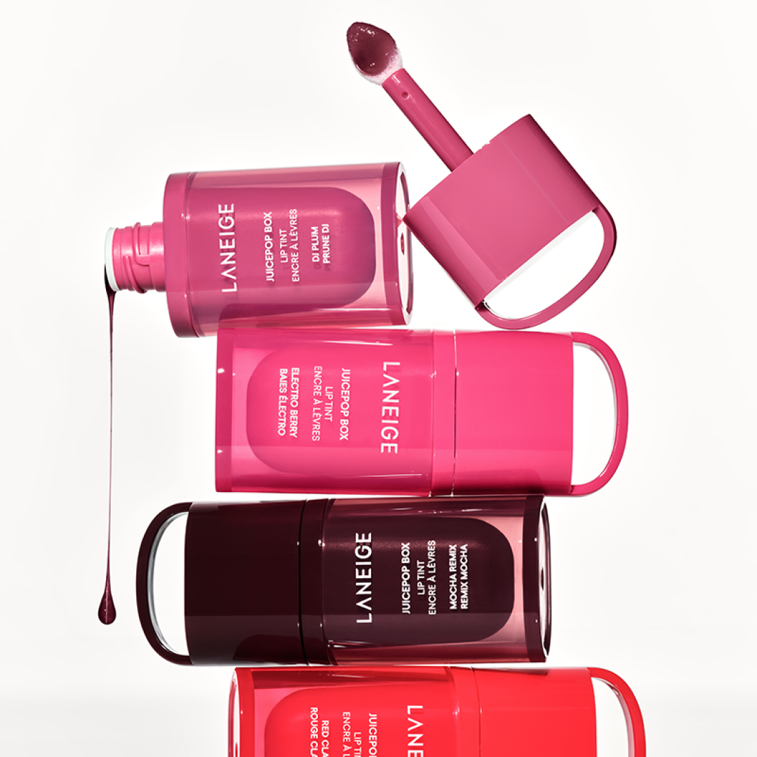 LANEIGE Juice Pop Box Lip Tint 4.5g, tubes rose/rouge, marque LANEIGE sur fond blanc, contexte maquillage