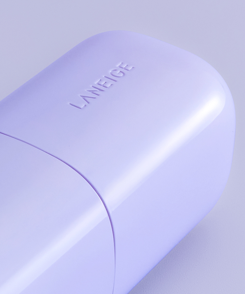 Photo produit : LANEIGE Skin Veil Base SPF28/PA++ 30ml, flacon violet sur fond clair, marque LANEIGE visible.