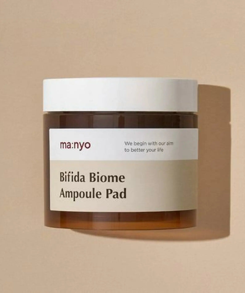 MA:NYO Bifida Biome Ampoule Pad 70 Sheets, pot cosmétique MANYO sur fond beige, étiquette Bifida Biome visible.