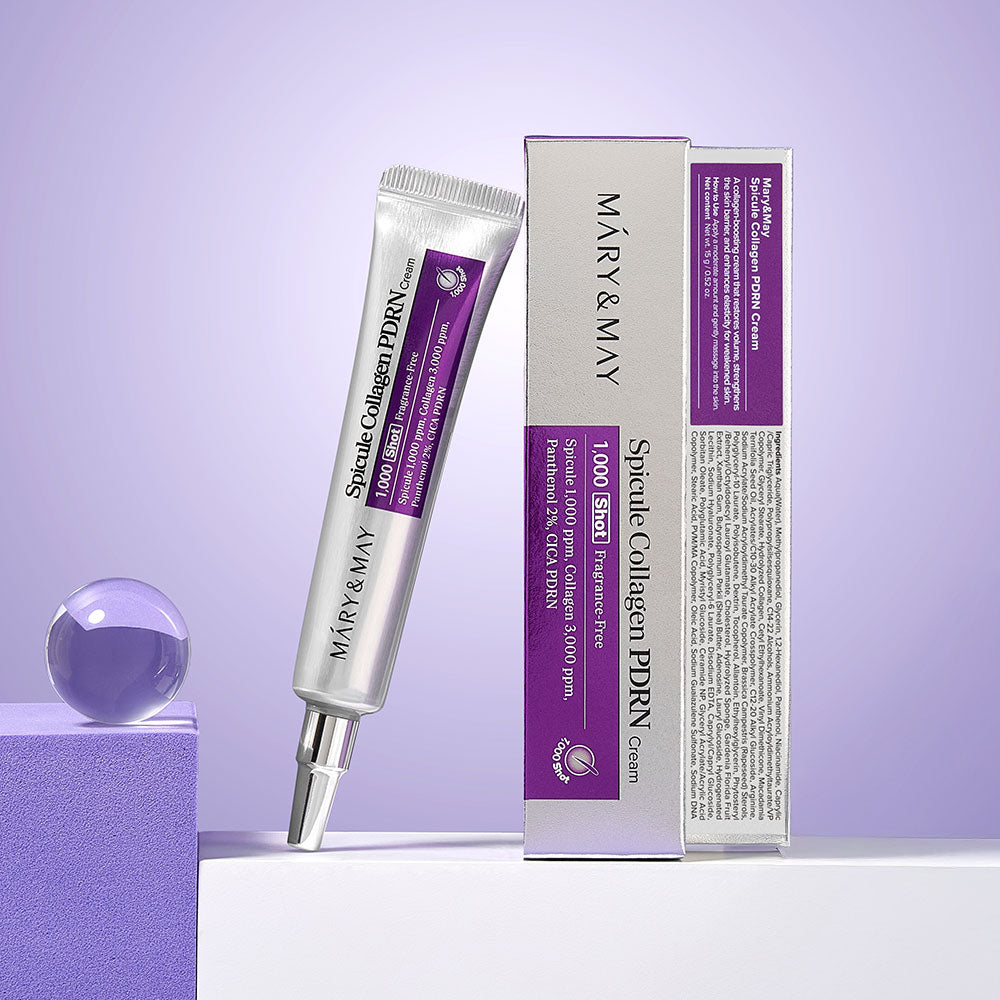Décris l'image en français : MARY&MAY  Speckle Collagen PDRN Cream 15g, tubes et boîte sur fond violet.
