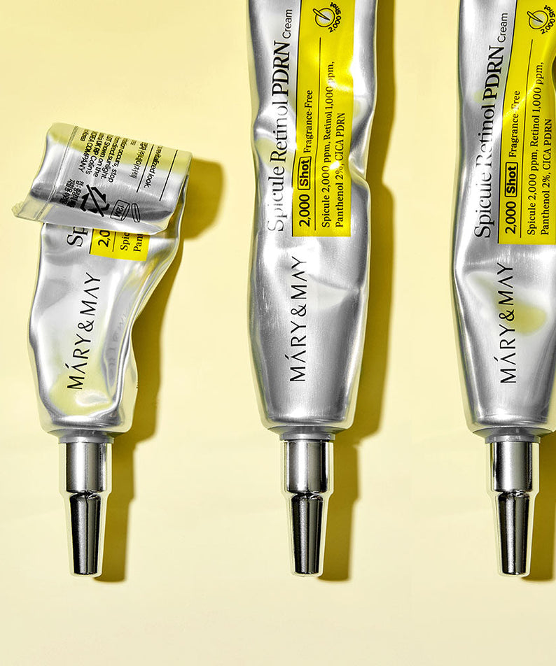 Crèmes MARY&MAY Speculum Retinol PDRN 15g alignées sur fond jaune, emballage métallique et détails dosages visibles.