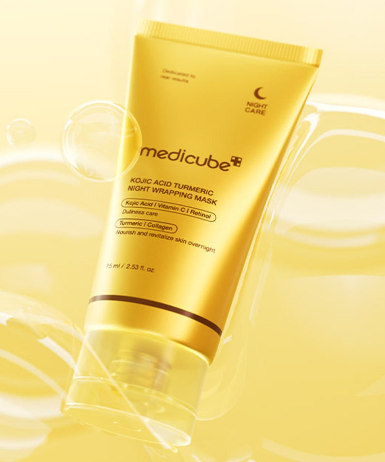 MEDICUBE Kojic Acid Turmeric Vita Wrapping Mask 75ml, marque Medicube, tube jaune sur fond crème avec bulles d’illustration.