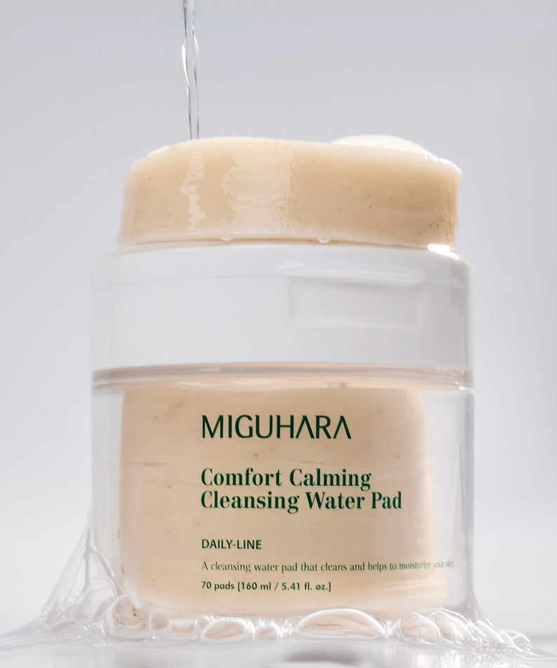Décris l'image en français : MIGUHARA Comfort Calming Cleansing Water Pads 70 Sheets, bocal crème sur fond blanc.