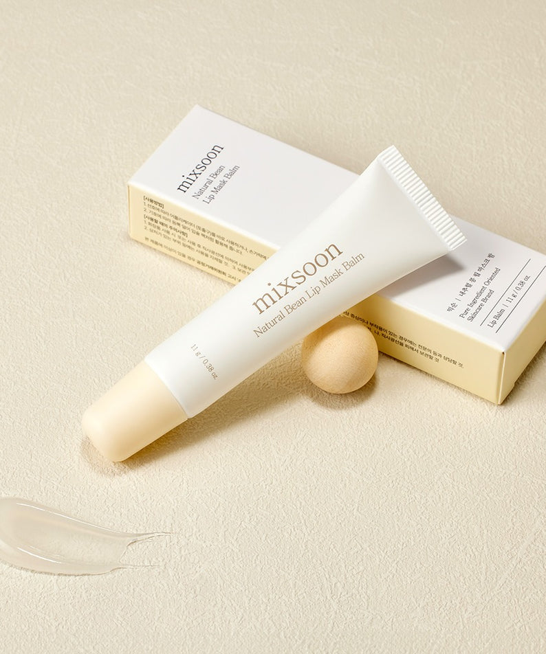 Baume à lèvres MIXSOON Natural Bean Lip Mask bean, hydratation naturelle et soin des lèvres, tube sur fond beige élégant.