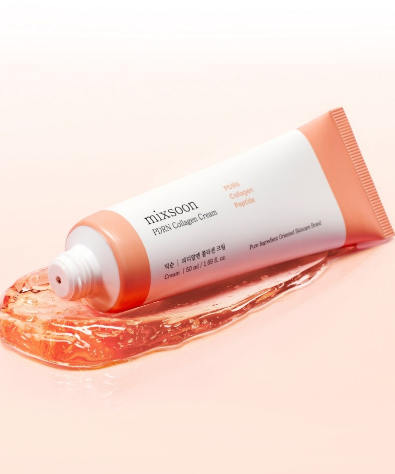 Crème MIXSOON PDRN Collagen 50ml sur texture de gelée orange, emballage élégant, soin visage hydratant, tube à moitié ouvert.