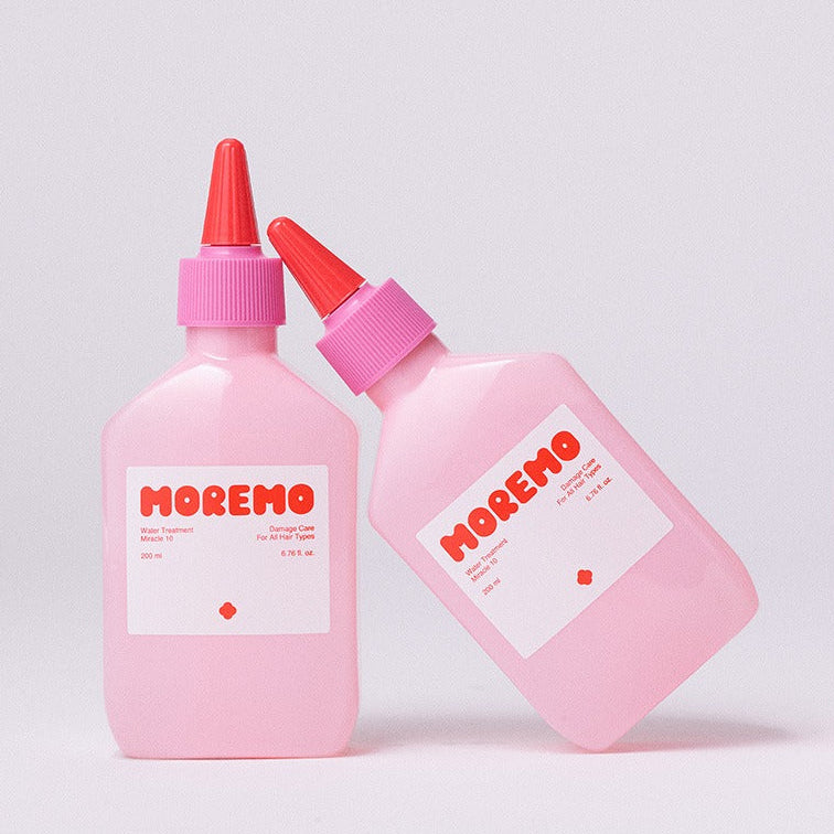 MOREMO Water Treatment Miracle 10 200ml, marque MOREMO, flacons roses avec embouts rouges sur fond clair, soin capillaire