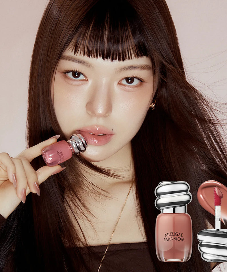MUZIGAE MANSION Rainbow Mansion Object Glossy Mini 1.8g, baume brillant rose, femme aux cheveux bruns sur fond clair.
