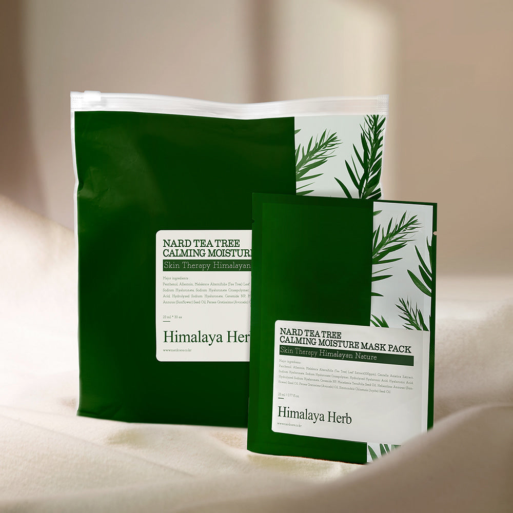 NARD Tea Tree Soothing Moisture Mask Pack 23ml 30 sheets, masque visage NARD, pack vert avec feuilles d’arbre à thé, sur table