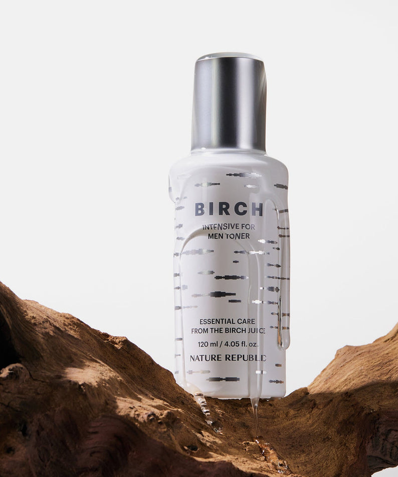 NATURE REPUBLIC Birch Intensive For Men Toner 120ml sur fond bois, design de flacon élégant et naturel. Parfait pour les soins masculins.