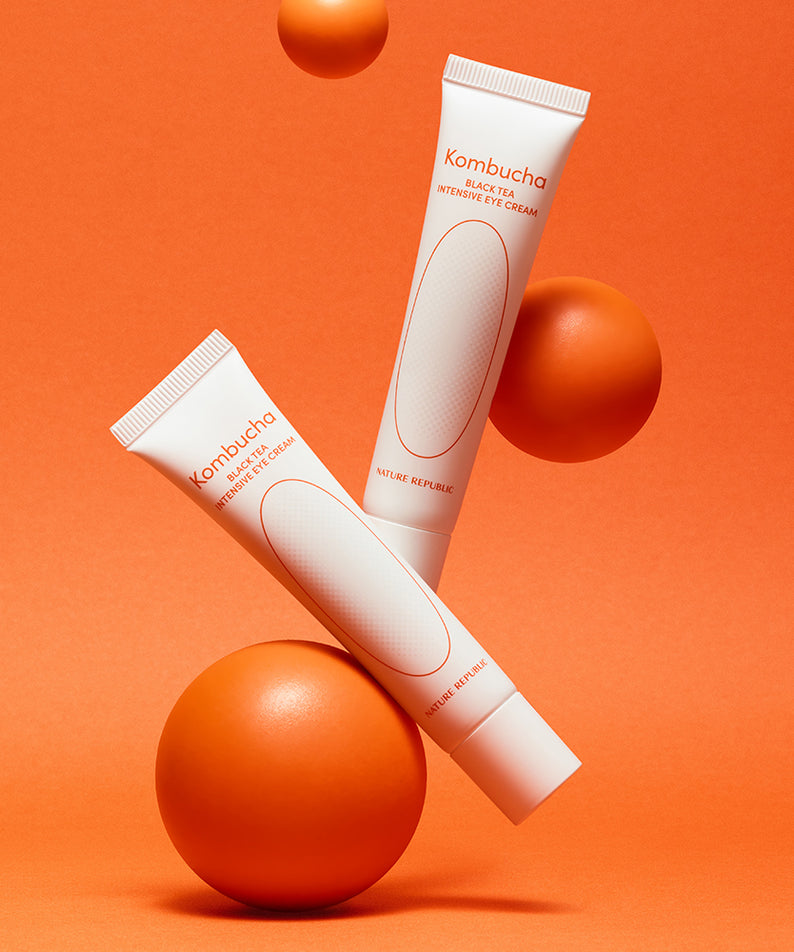 NATURE REPUBLIC Kombucha Black Tea Eye Cream 30ml tubes sur fond orange