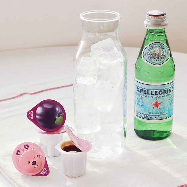 Décris l'image en français : NOTHING BETTER Zanmang Loopy Cup Purun & Lactobacillus 14p, marque, accessoires sur table.