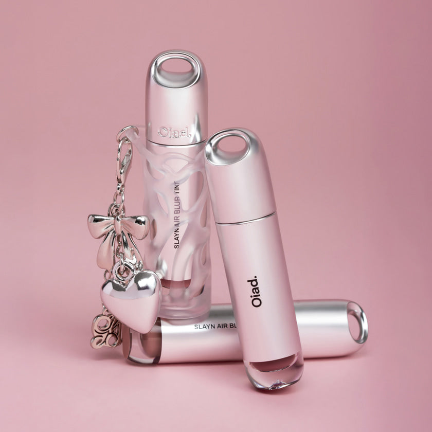 OIAD Slayn Air Blur Tint 8 colors, flacons rose sur fond pastel, marque OIAD, visuel cosmétique maquillage