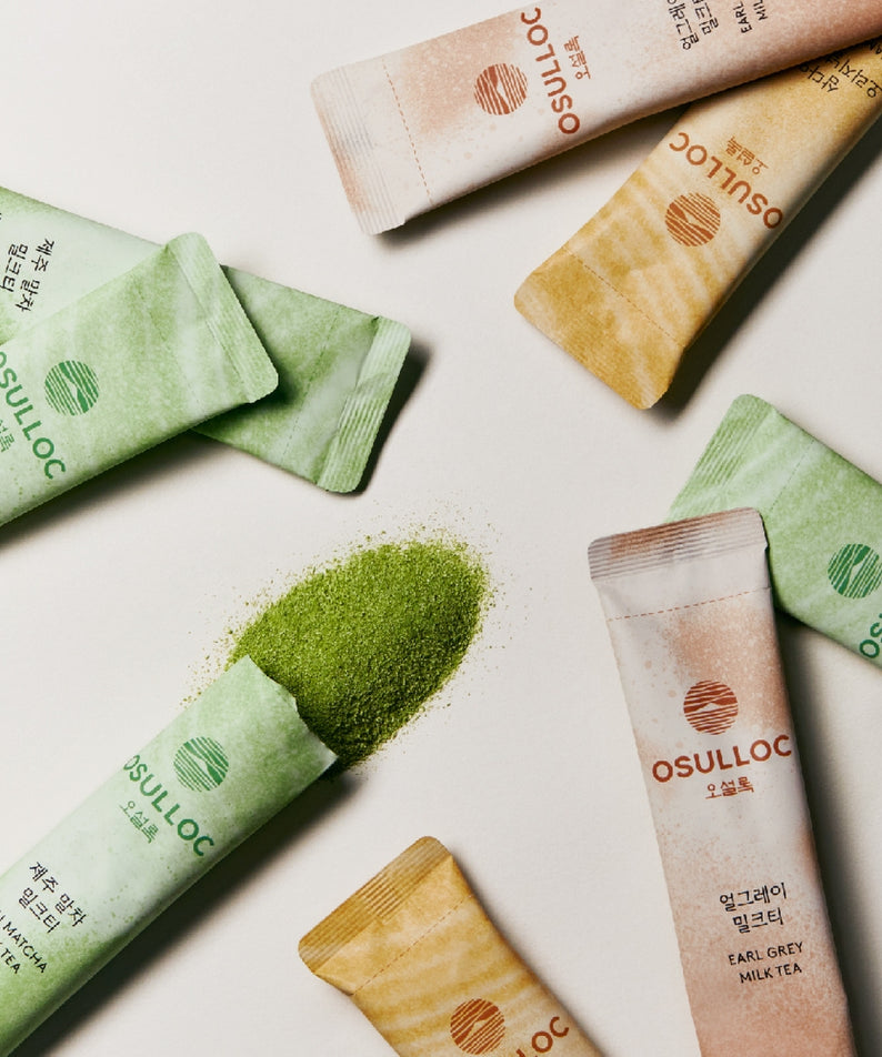 OSULLOC Earl Grey Milk Tea 10 p, marque Osulloc, sachets colorés sur fond clair avec thé Earl Grey en poudre.