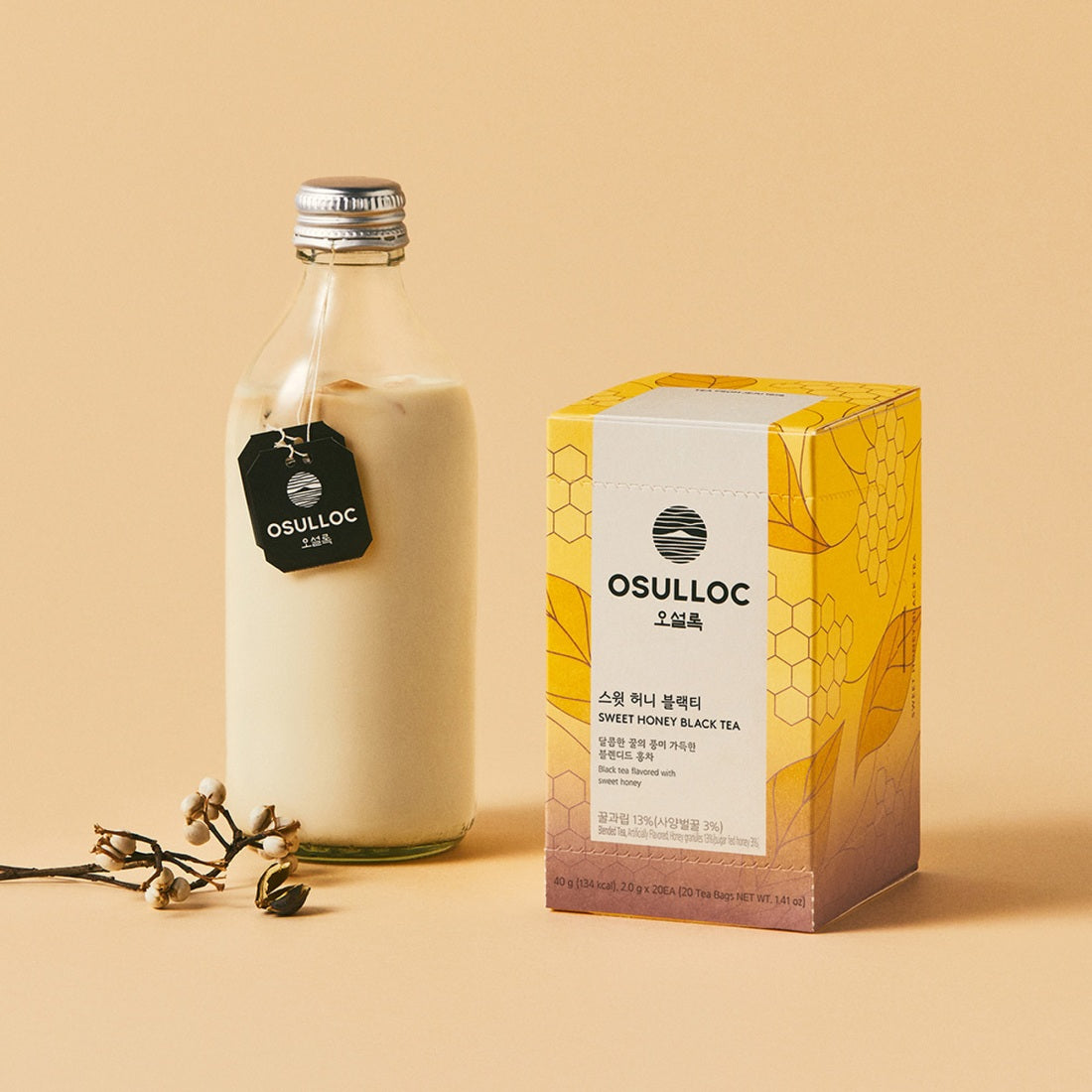 OSULLOC Sweet Honey Black Tea 20 P : bouteille et boîte sur fond beige, miel et thé noir, marque OSULLOC en visuel.