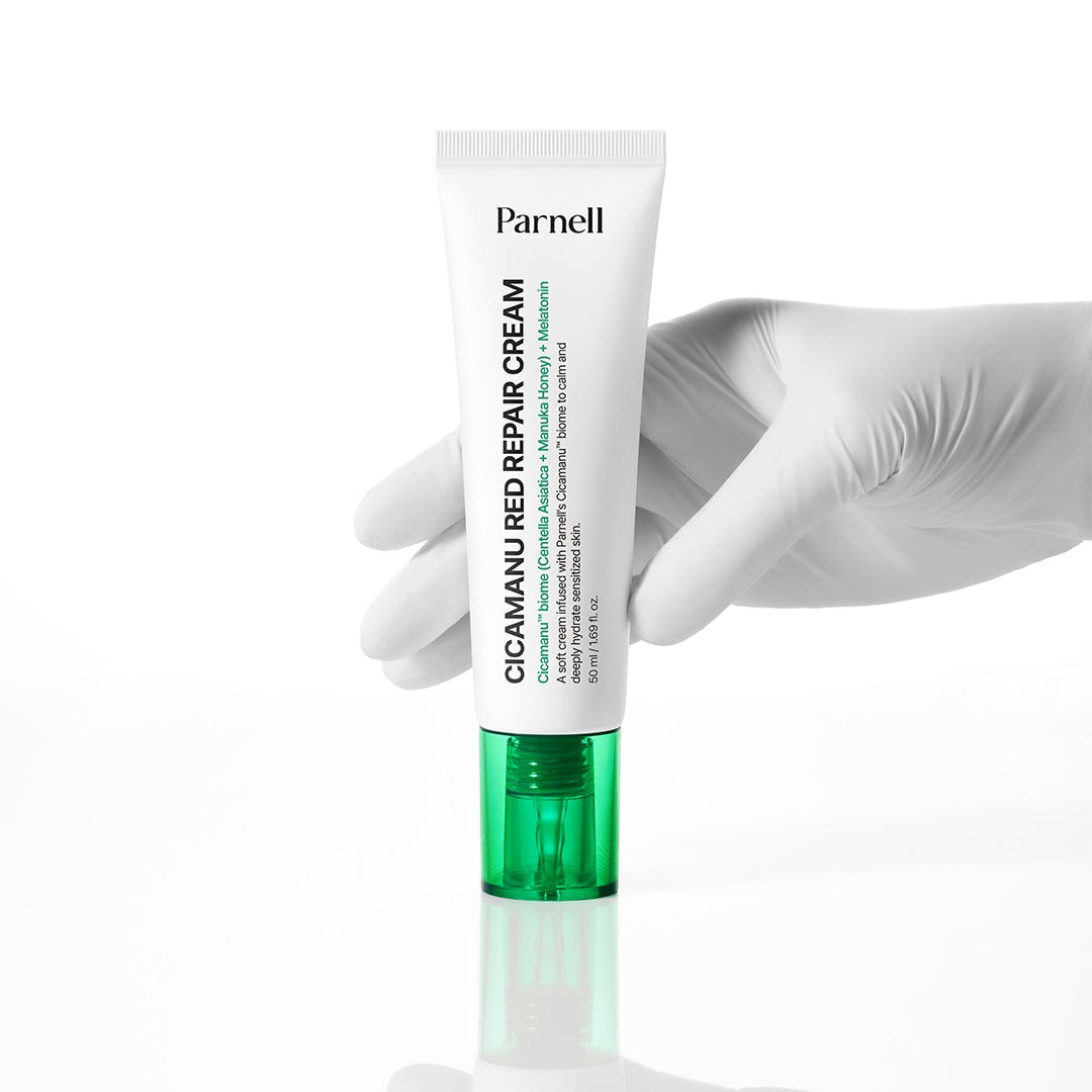 PARNELL Cica Manu Red Repair Cream 50ml : tube sur fond blanc, mains gantées, marque Parnell, contexte visuel produit