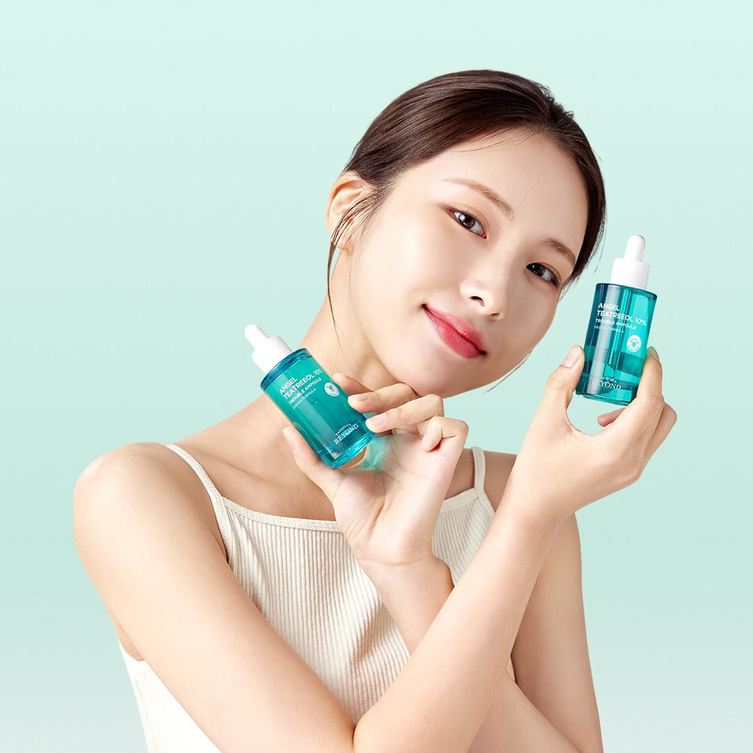 PASSION & BEYOND Angel Tea Tree 10% Trouble Ampoule 50ml, flacon vert sur photo produit PASSION&BEYOND, fond bleu clair