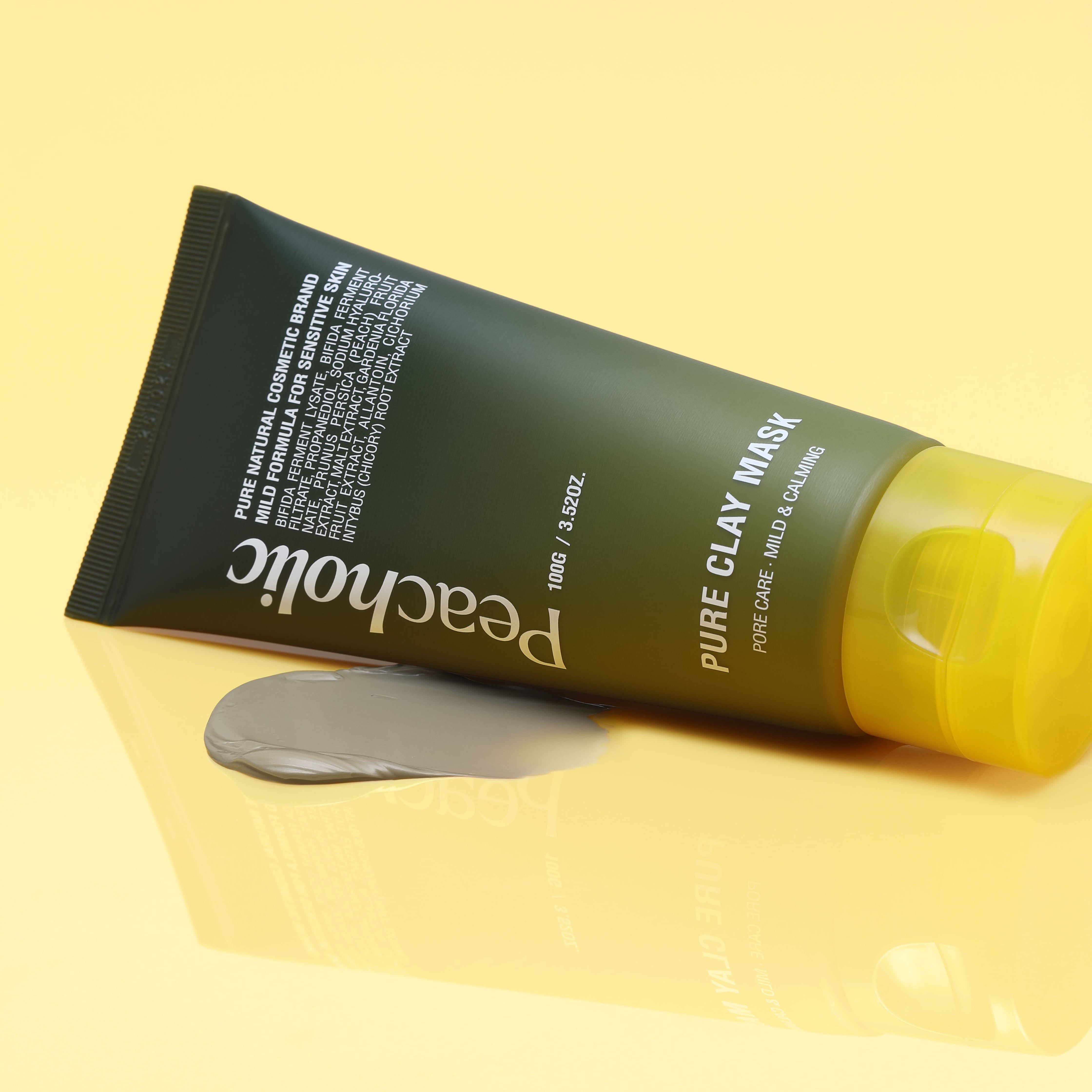 PEACHOLIC  Pure Clay Mask 100ml, tube sur fond jaune, marque PEACHOLIC visible, contexte cosmétique beauté.