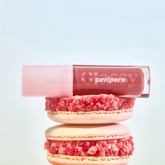 PERIPERA Ink Glazing Lip Gloss, tube rose sur fond clair, visuel maquillage gourmand avec texture sucrée