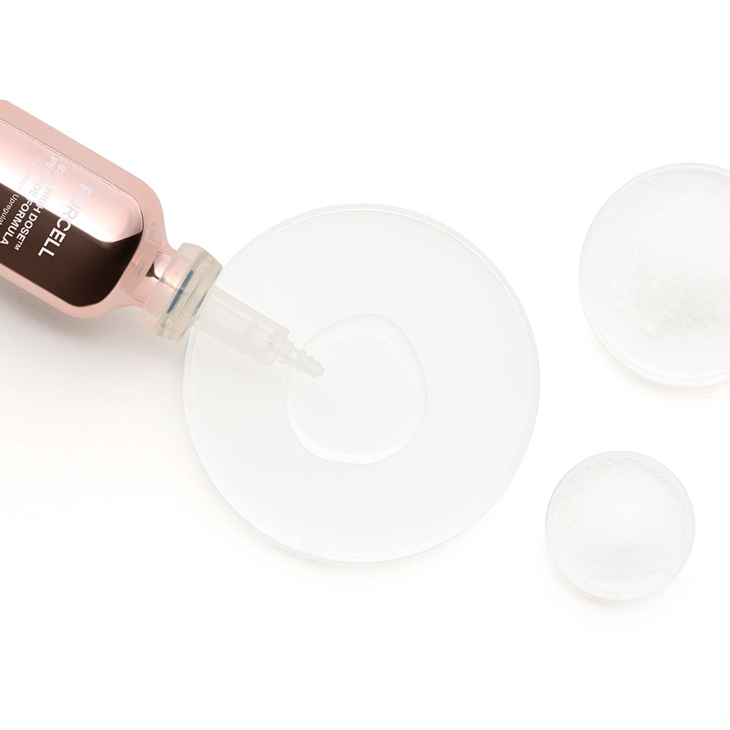PURCELL 82% High Dose™ Peptide Formula 30mL de Purcell, flacon rose et ampoules, contexte visuel blanc.